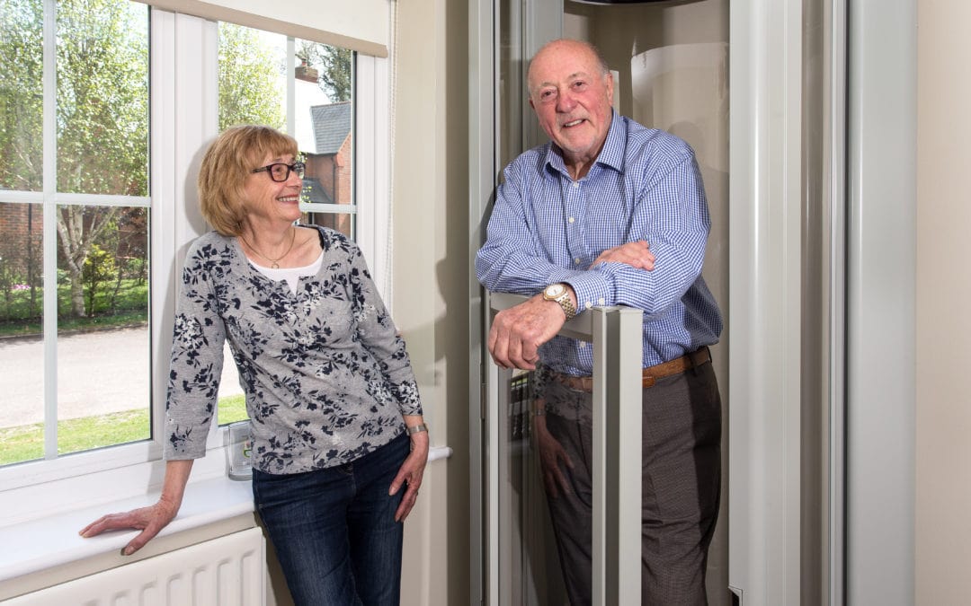 A husband and wife enjoying their Lifton Home Lift.